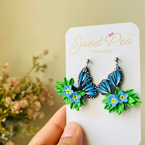 Blue butterfly and forget me not